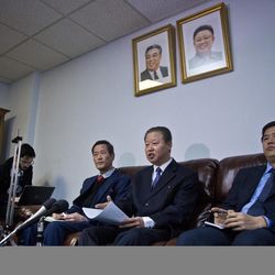 North Korea's U.N. Ambassador Jang II Hun, center, is seated between North Korea's mission consulars Kin Song, left, and Kwon Jong Gun, right, as he speaks during a press conference, Monday, Feb. 16, 2015, at North Korea's  Mission in New York. North Korea says it will respond "very strongly" to a conference in Washington on Tuesday about its widespread human rights abuses. 