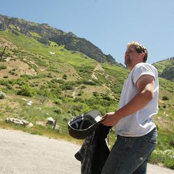 Daniel Blake walks near the trailhead as where his roommate Tyler Mayle is missing. Search and rescue crews look for him near Y Mountain in Provo Tuesday, June 4, 2013. Mayle is a BYU student and has been missing since Saturday.