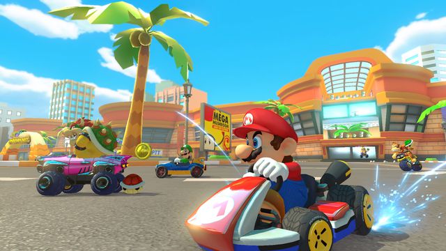 Mario, Luigi, and Bowser race on Coconut Mall in Mario Kart 8 Deluxe