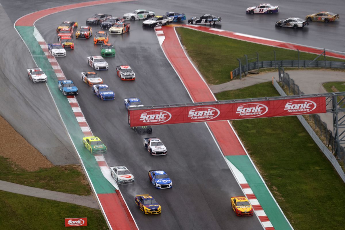 Joey Logano, driver of the #22 Shell Pennzoil Ford, and Austin Cindric, driver of the #33 Pirtek Ford, lead the field during the NASCAR Cup Series EchoPark Texas Grand Prix at Circuit of The Americas on May 23, 2021 in Austin, Texas.