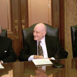 President Howard W. Hunter, 86, sits between his two counselors, Presidents Gordon B. Hinckley, left, and Thomas S. Monson.