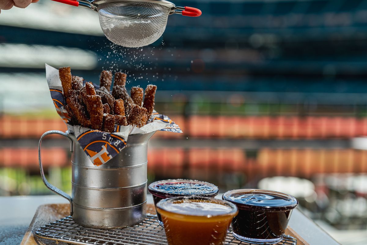 Funnel cake fries with three dipping sauces.