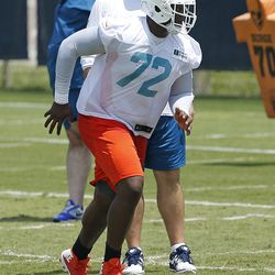 DAVIE, FL - MAY 23: Ja'Wuan James #72 of the Miami Dolphins and fellow players participate in drills during the rookie minicamp on May 23, 2014 at the Miami Dolphins training facility in Davie, Florida. 