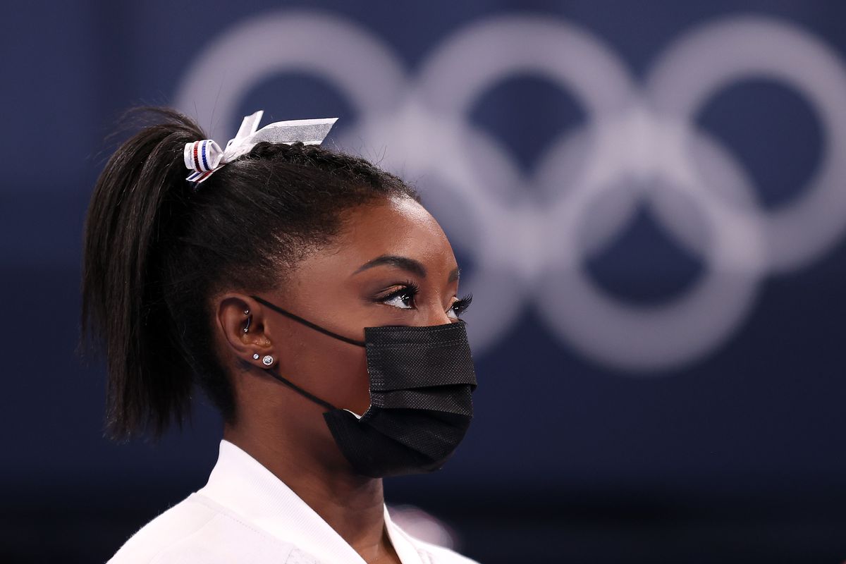 Gymnast Simone Biles, wearing a mask.