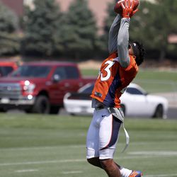 Broncos S T.J. Ward stretches out for a pass during his workout after the first Training Camp practice finished.