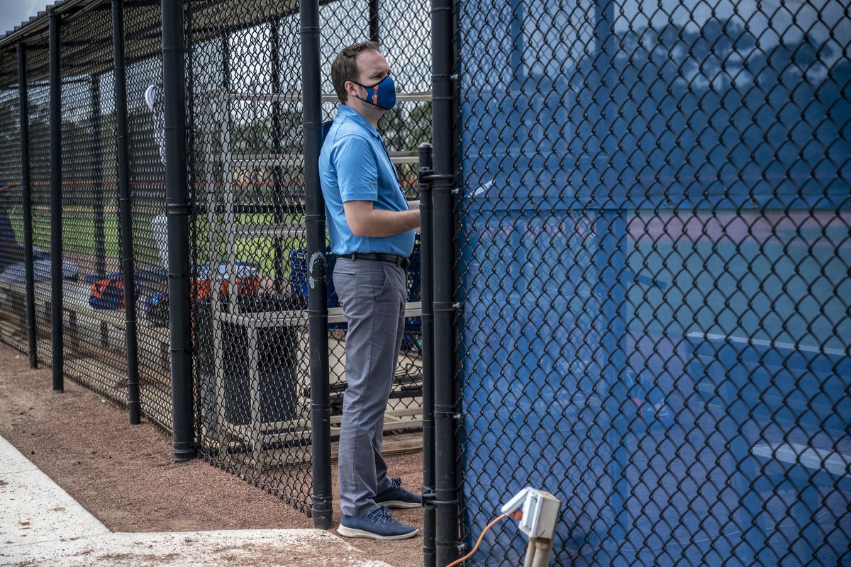 New York Mets’ Acting General Manager Zack Scott watches his team’s spring training workout