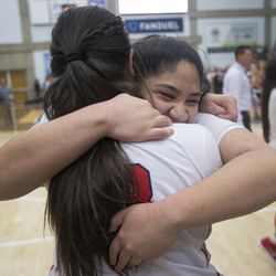 East's Lani Taliauli hugs teammate Liana Kaitu’u following East's 68-48 victory against Timpview in the Class 5A state championship game at Salt Lake Community College in Taylorsville on Saturday, Feb. 24, 2018.