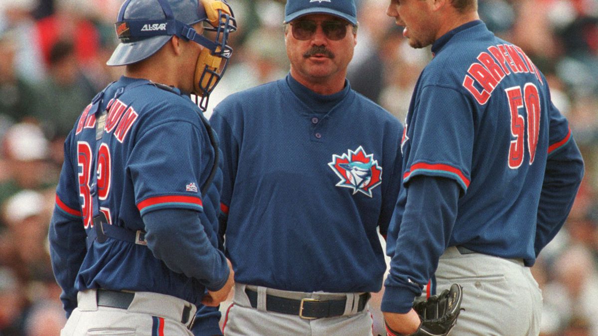Toronto Blue Jays catcher Kevin Brown (L) and mana