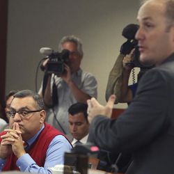 Clark County Registrar of Voters, Joe Gloria, left, listens as Brian Hardy, attorney for Donald Trump campaign presents his argument at the Regional Justice Center Tuesday, Nov. 8, 2016, in Las Vegas. A judge denies a request by the Donald Trump campaign to preserve ballots from several early voting sites in Southern Nevada because of alleged election violations. 