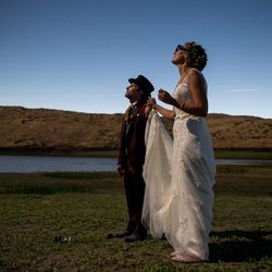 Liam Dorney, of Brisbane, Australia, left, and Elien Wijns, of Brussels, Belgium, take in the moments just after totality of the solar eclipse at Mann Creek Reservoir near Weiser, Idaho, on their wedding day, Monday, Aug. 21, 2017. The couple met while viewing a total solar eclipse in Australia, got engaged while viewing another total solar eclipse in the Faroe Islands and have since seen another in Indonesia. The couple wed later Monday after viewing this latest total solar eclipse with family and friends.
