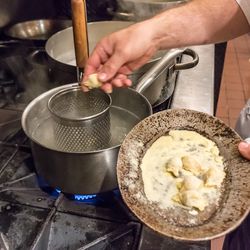 When an order comes in, 10 agnolotti go into boiling salted water.