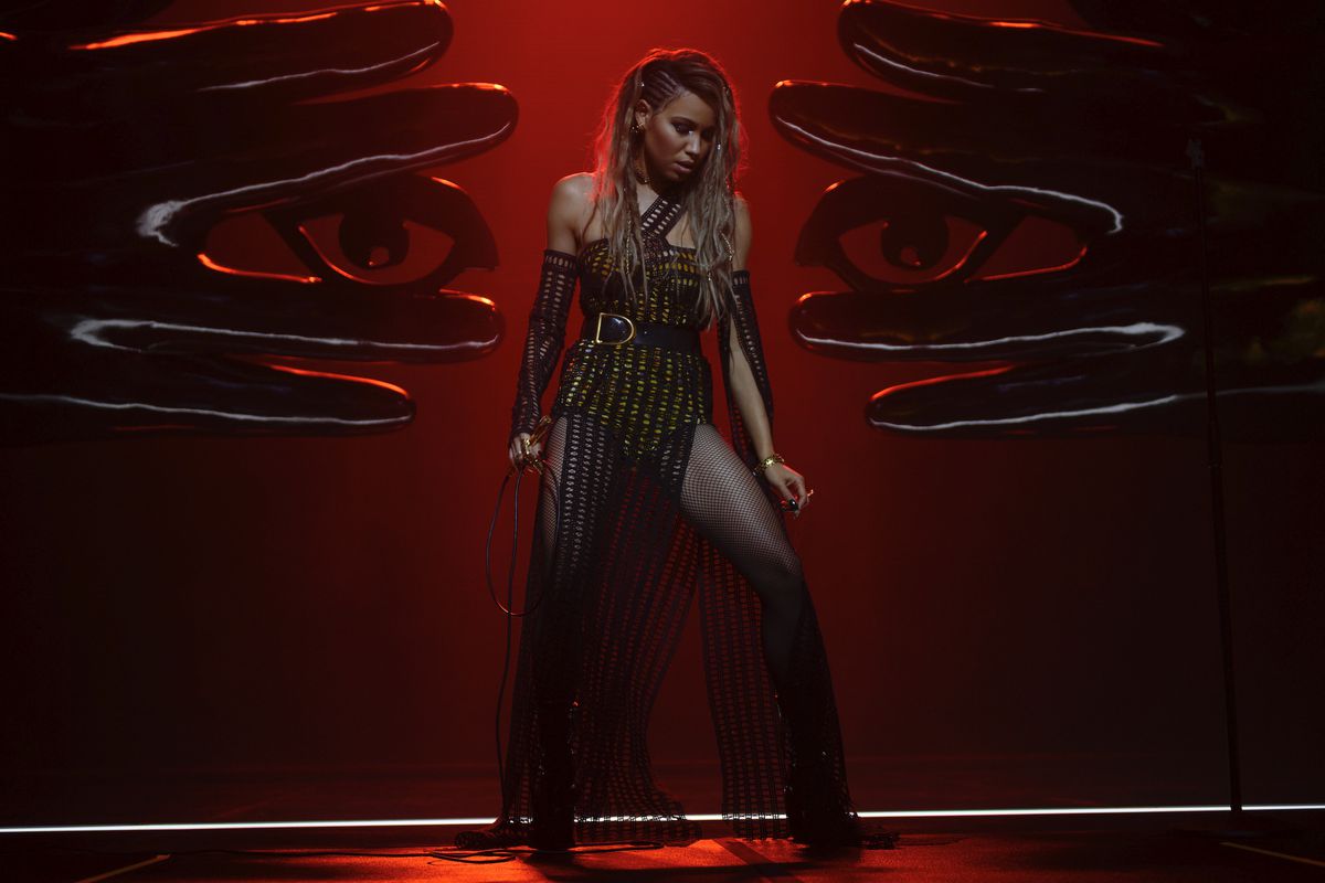 JURNEE SMOLLETT-BELL stands center stage in a red spotlight as Black Canary in Warner Bros. Pictures’ “BIRDS OF PREY (AND THE FANTABULOUS EMANCIPATION OF ONE HARLEY QUINN).