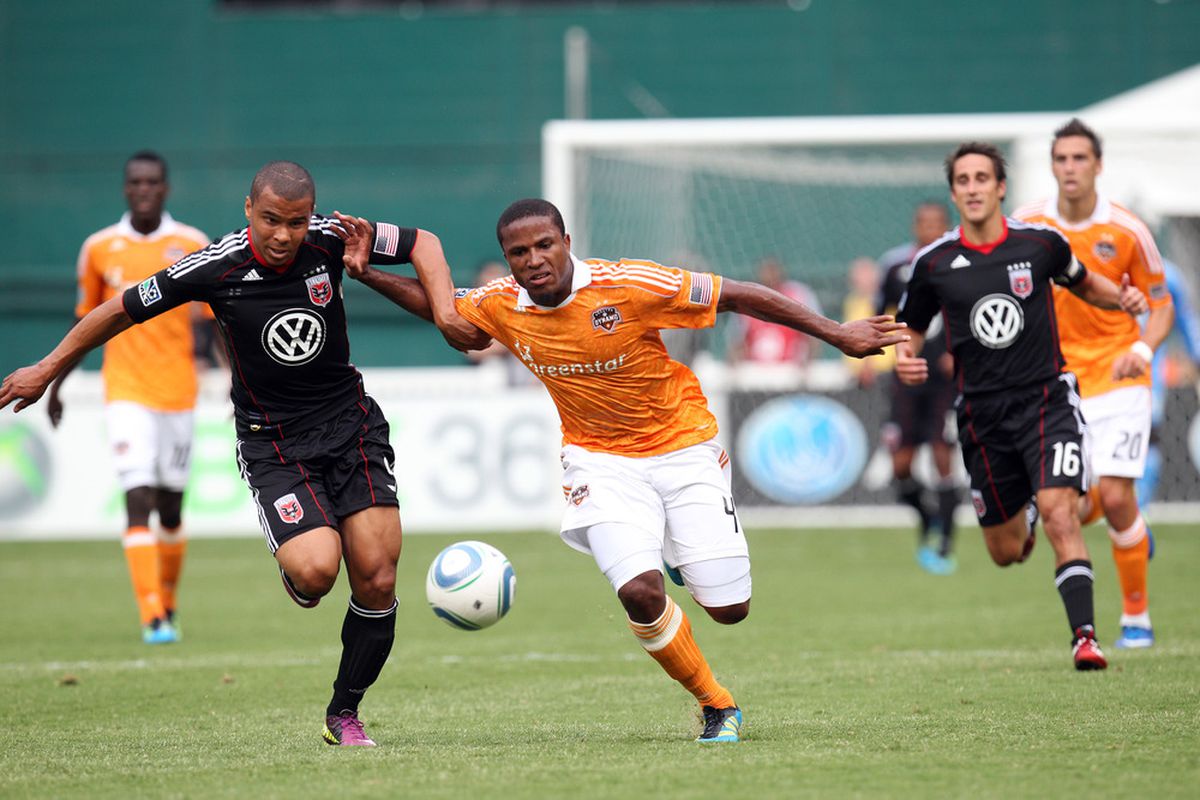 WASHINGTON, DC - JUNE 25: Jermaine Taylor #4 of the Houston Dynamo controls the ball against Charlie Davies #9 of D.C. United at RFK Stadium on June 25, 2011 in Washington, DC. (Photo by Ned Dishman/Getty Images)