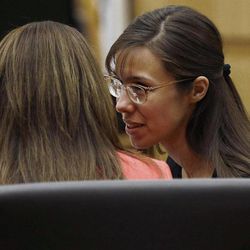 Defense attorney Jennifer Wilmott listens to defendant Jodi Arias, right, as lead defense attorney Kirk Nurmi make his closing arguments  during her trial Friday, May 3, 2013 at Maricopa County Superior Court in Phoenix.  Arias is charged with first-degree murder in the stabbing and shooting death of Travis Alexander, 30, in his suburban Phoenix home in June 2008. 