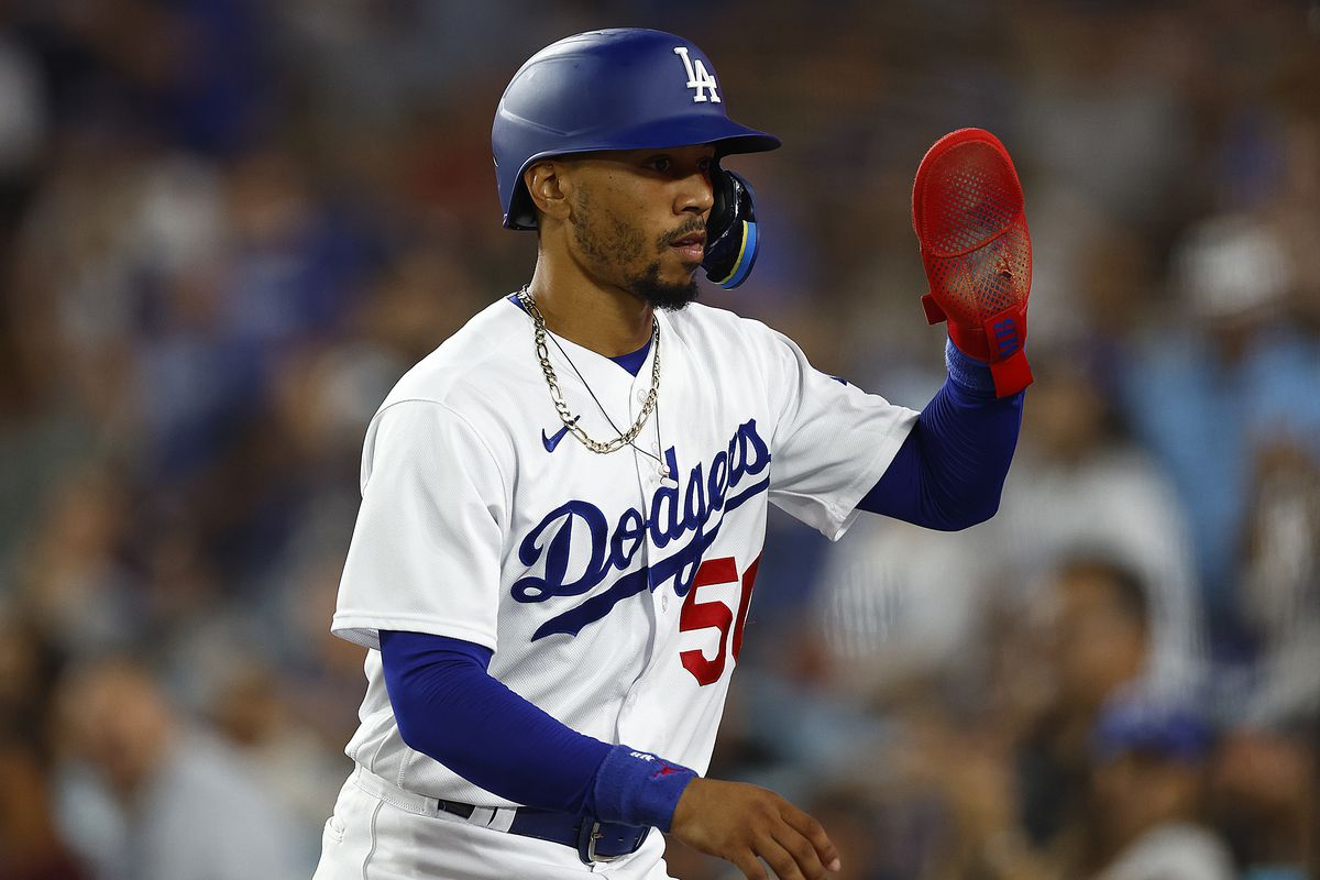 &nbsp;Mookie Betts #50 of the Los Angeles Dodgers celebrates a run against the Cincinnati Reds in the seventh inning at Dodger Stadium on July 28, 2023 in Los Angeles, California.