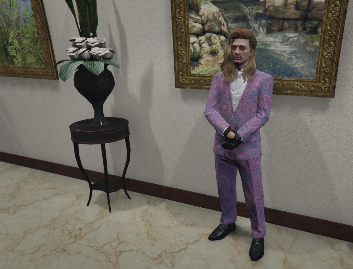 GTA Online - Charlie Bradstock, in a pastel pink and purple suit, poses at an in-game museum event