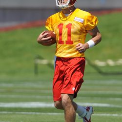 Kansas City Chiefs quarterback Alex Smith (11) runs downfield during organized team activities at the University of Kansas Hospital Training Complex. 
