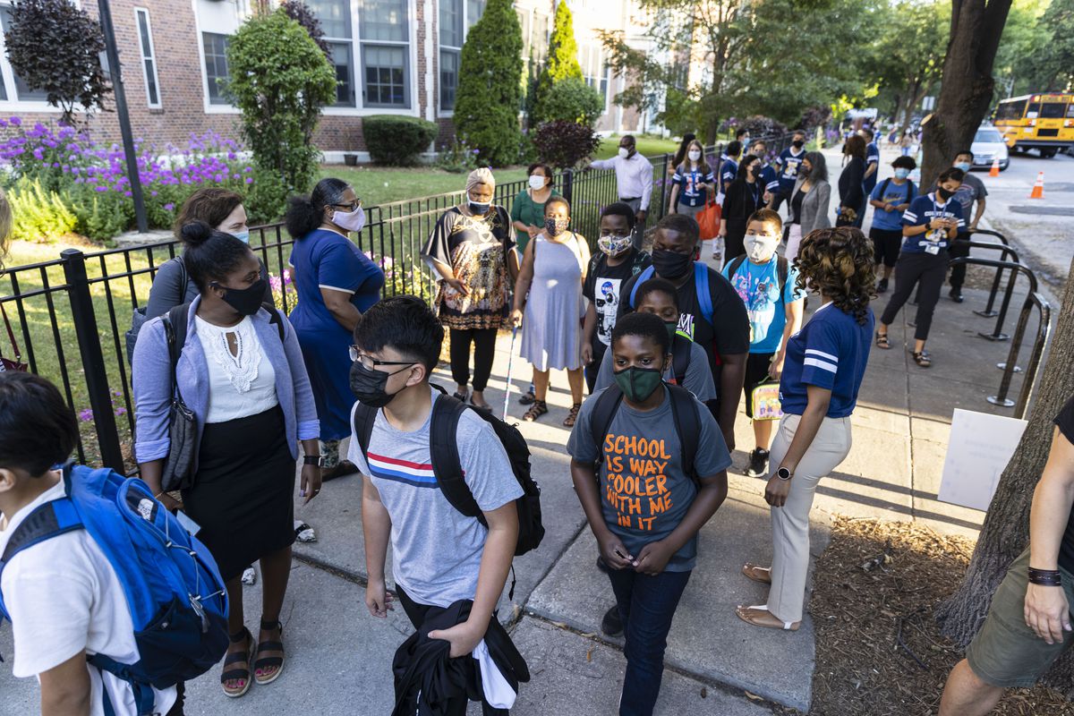 Students make their to the classrooms on the first day back to school at Mary E. Courtenay Language Arts Center at 4420 N Beacon St. in Uptown, Monday, Aug. 30, 2021.