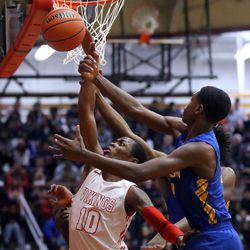 Homewood-Flossmoor’s Maurion Scott (10) blocks out Simeon’s Antonio Reeves (3) for the rebound in Blue Island Friday, March 8, 2019. | Kevin Tanaka/For the Sun Times