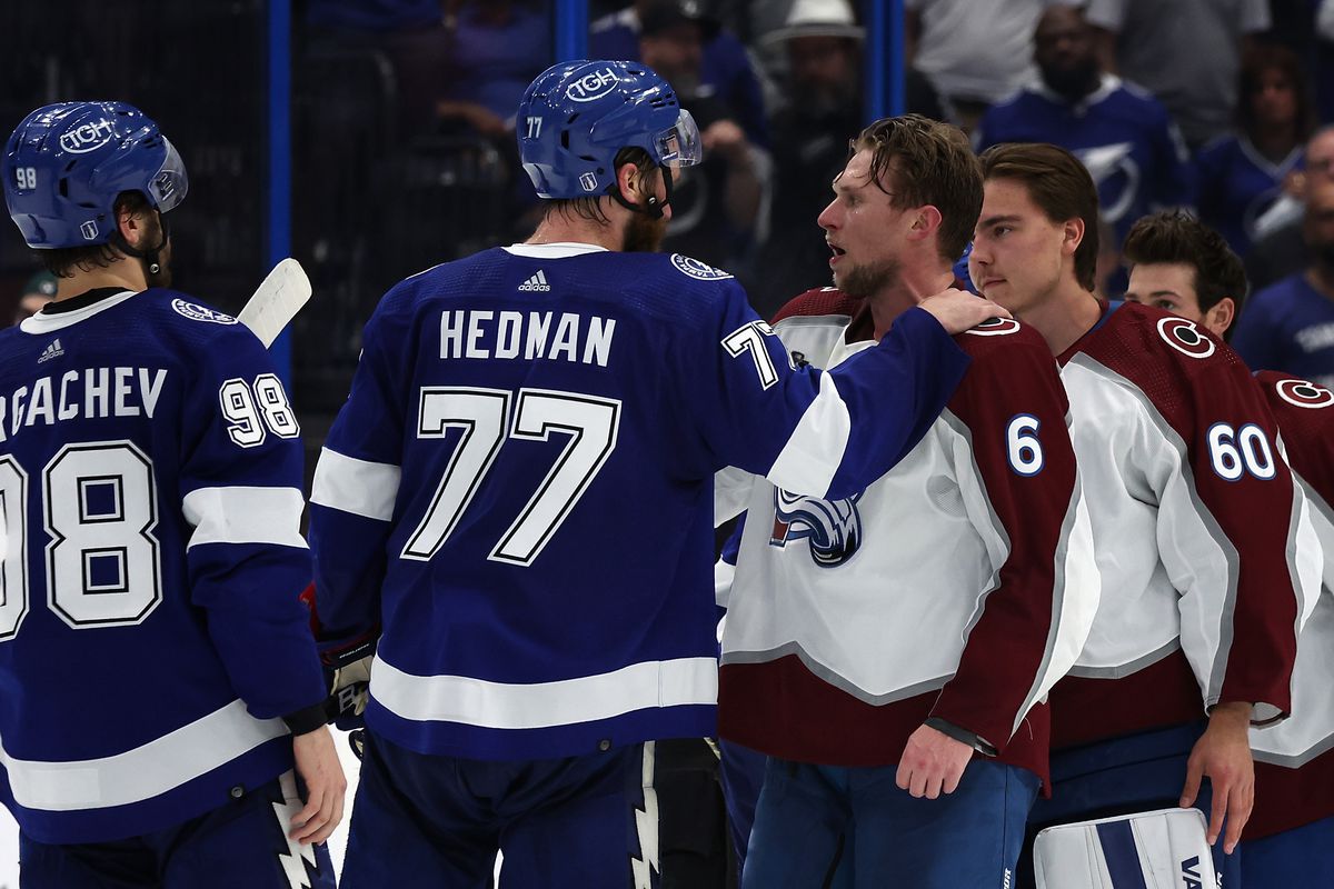 Erik Johnson of the Colorado Avalanche shakes hands with Victor Hedman of the Tampa Bay Lightning following Game Six of the 2022 NHL Stanley Cup Final at Amalie Arena on June 26, 2022 in Tampa, Florida. The Avalanche defeated the Lightning 2-1.