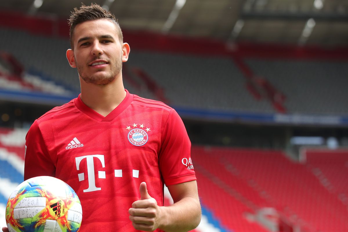 MUNICH, GERMANY - JULY 08: Lucas Hernandez of FC Bayern Muenchen poses with the Adidas Conext 19, official ball of the 2019 FIFA Women's World Cup France, after a press conference to present new signing Lucas Hernandez at Allianz Arena on July 08, 2019 in Munich, Germany.