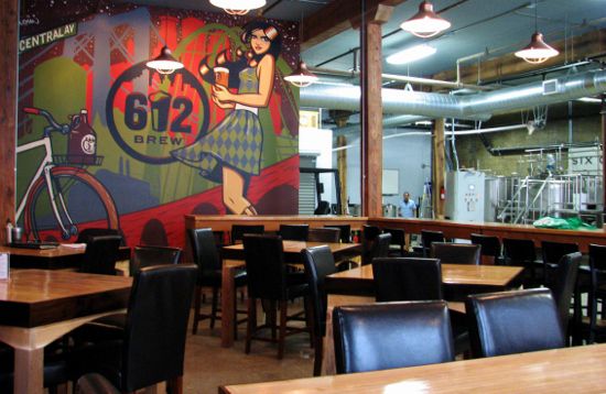 Inside the taproom with an Adam Turmann mural of a girl in plaid holding a platter of beer