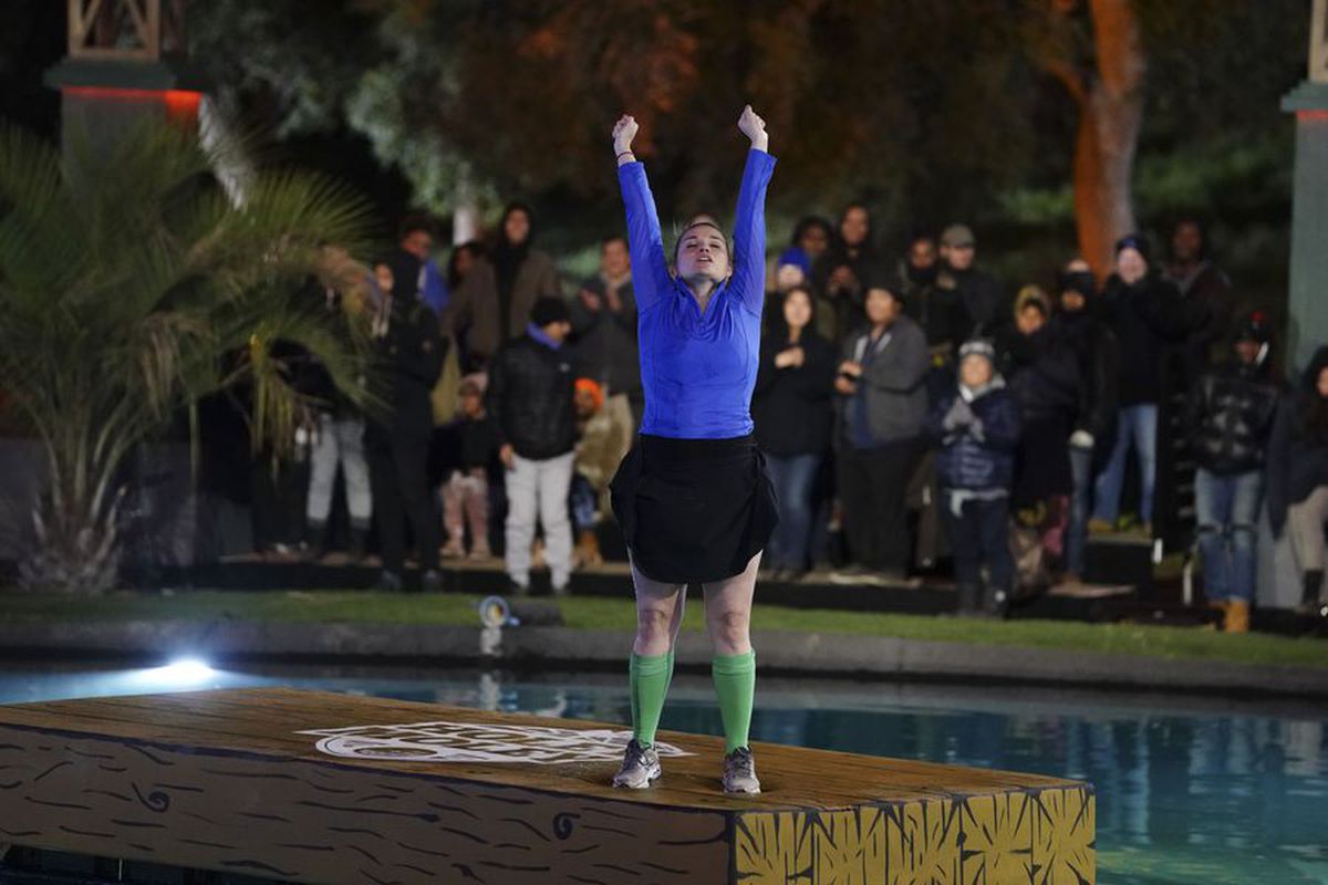 Holly Fine lands on a floating obstacle in the ABC reality TV show “Holey Moley”