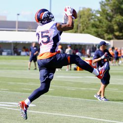 Chris Harris Jr. makes a catch during cornerback drills on the first day of Denver Broncos training camp. 