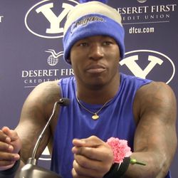 BYU running back Jamaal Williams wears a pink flower during the postgame press conference following the Cougars' 28-10 win over Utah State at LaVell Edwards Stadium on Saturday, Nov. 26, 2016. People wore pink at the game to honor Elsie Mahe, the 3-year-old daughter of Reno Mahe who became entangled in a mini-blind cord on Tuesday and remains hospitalized.
