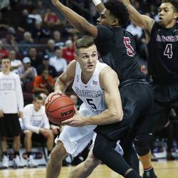Brigham Young Cougars guard Kyle Collinsworth (5) drives on Santa Clara Broncos guard Brendyn Taylor (5) during the WCC tournament in Las Vegas Saturday, March 5, 2016. BYU won 72-60. 