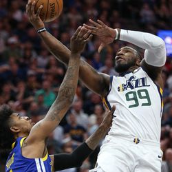 Utah Jazz forward Jae Crowder (99) goes to the hoop over Golden State Warriors guard Nick Young (6) during the game at Vivint Arena in Salt Lake City on Tuesday, April 10, 2018.