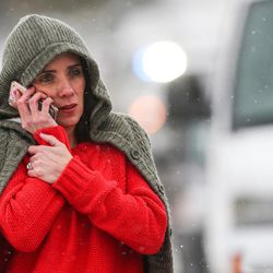 Becky Browning, whose son is in eighth grade at Mueller Park Junior High School in Bountiful, talks to her ex-husband as she waits for information about a shooting at the school on Thursday, Dec. 1, 2016.