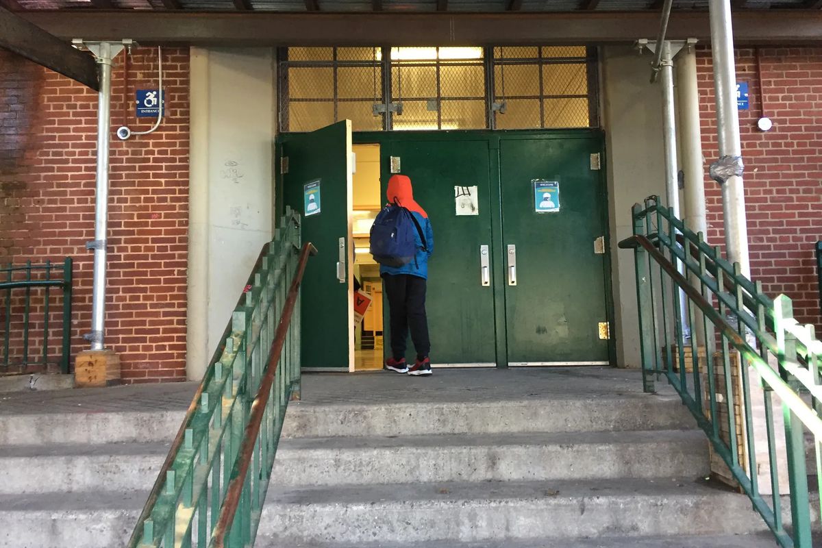 A student enters the building on Feb. 25, 2021 at M.S. 51 in Park Slope, Brooklyn. Middle schools in District 15 had eliminated screens pre-pandemic.
