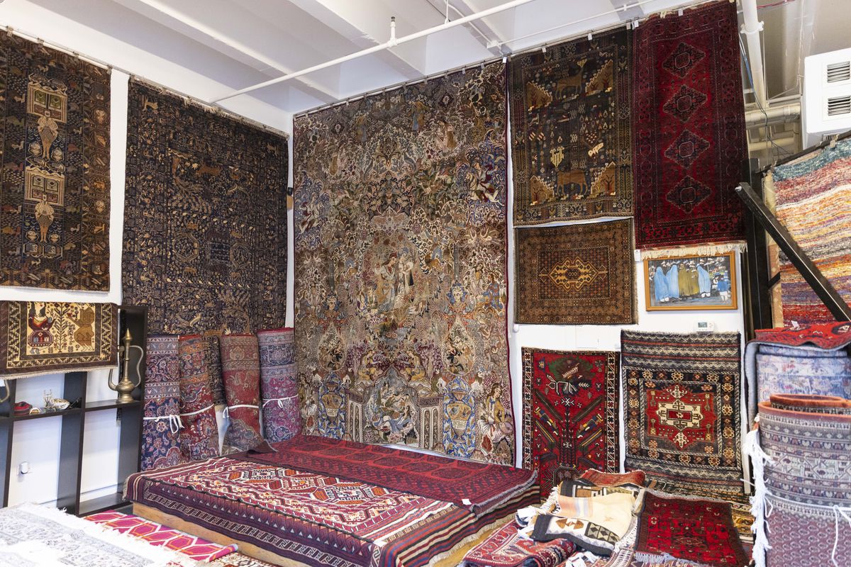 Traditional Afghan rugs on display at Shams Frough’s Evanston shop, Kapisa Rugs.