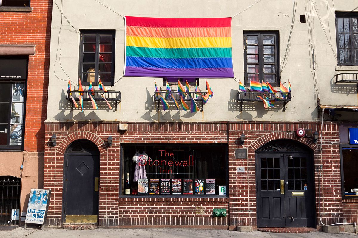 New York City’s Stonewall Inn decorated with rainbow flags.
