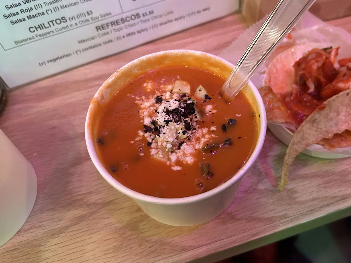 A small cup of tortilla soup is topped with crumbly cheese at Playita, a new Mexican restaurant on the Lower East Side.