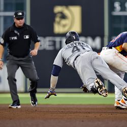 Carlos Santana #41 of the Seattle Mariners dives to second base after hitting a double against the Houston Astros during the sixth inning