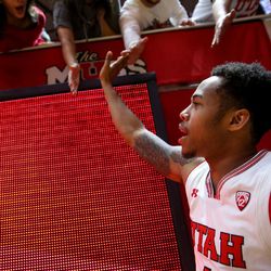 Utah Utes guard Justin Bibbins (1) greets fans after the Utes won 77-43 over the California Golden Bears at the Huntsman Center in Salt Lake City on Saturday, Feb. 10, 2018.