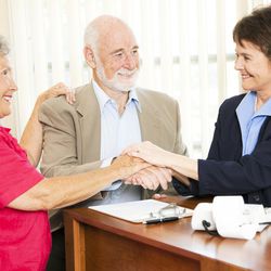 A couple talks to a financial advisor about their retirement.
