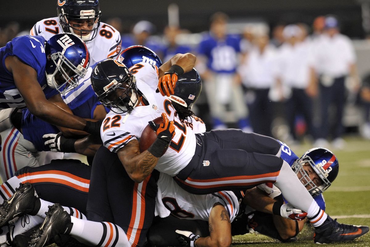 Aug 24, 2012; East Rutherford, NJ, USA; Chicago Bears running back Matt Forte (22) pushes forward on a rush attempt during the first half against the New York Giants at Metlife Stadium. Mandatory Credit: Joe Camporeale-US PRESSWIRE