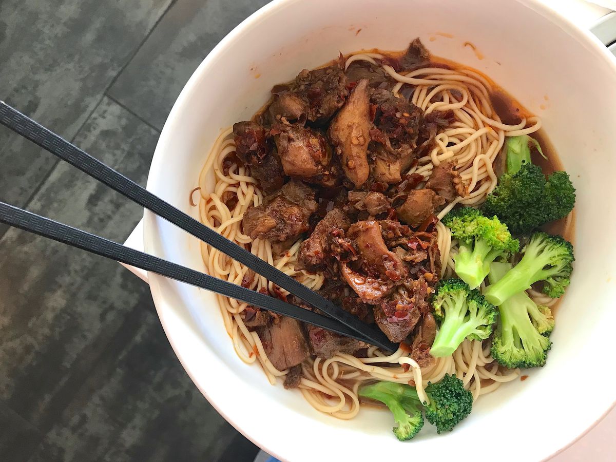 Guizhou-style spicy chicken with noodles and broccoli.