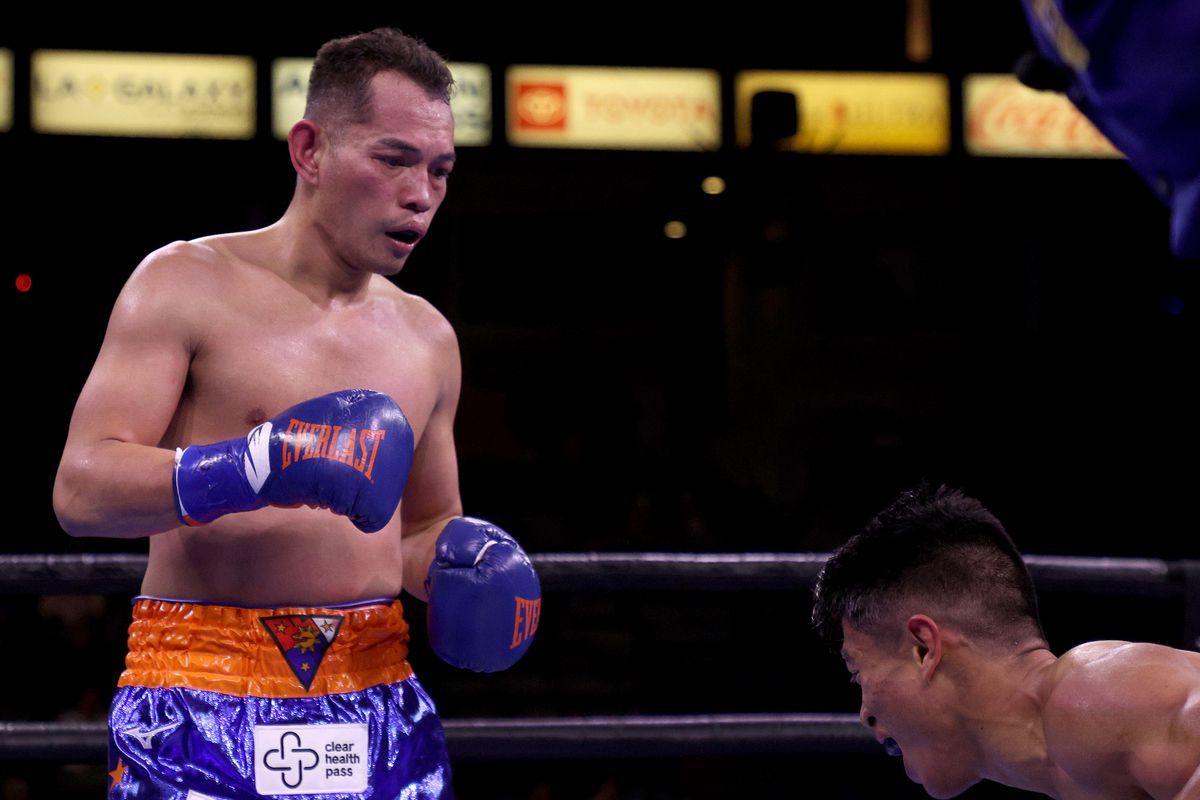 Nonito Donaire watches as Reymart Gaballo reacts to a body shot resulting in a third round knockout win for the WBC World Bantamweight Championship at Dignity Health Sports Park on December 11, 2021 in Carson, California.  