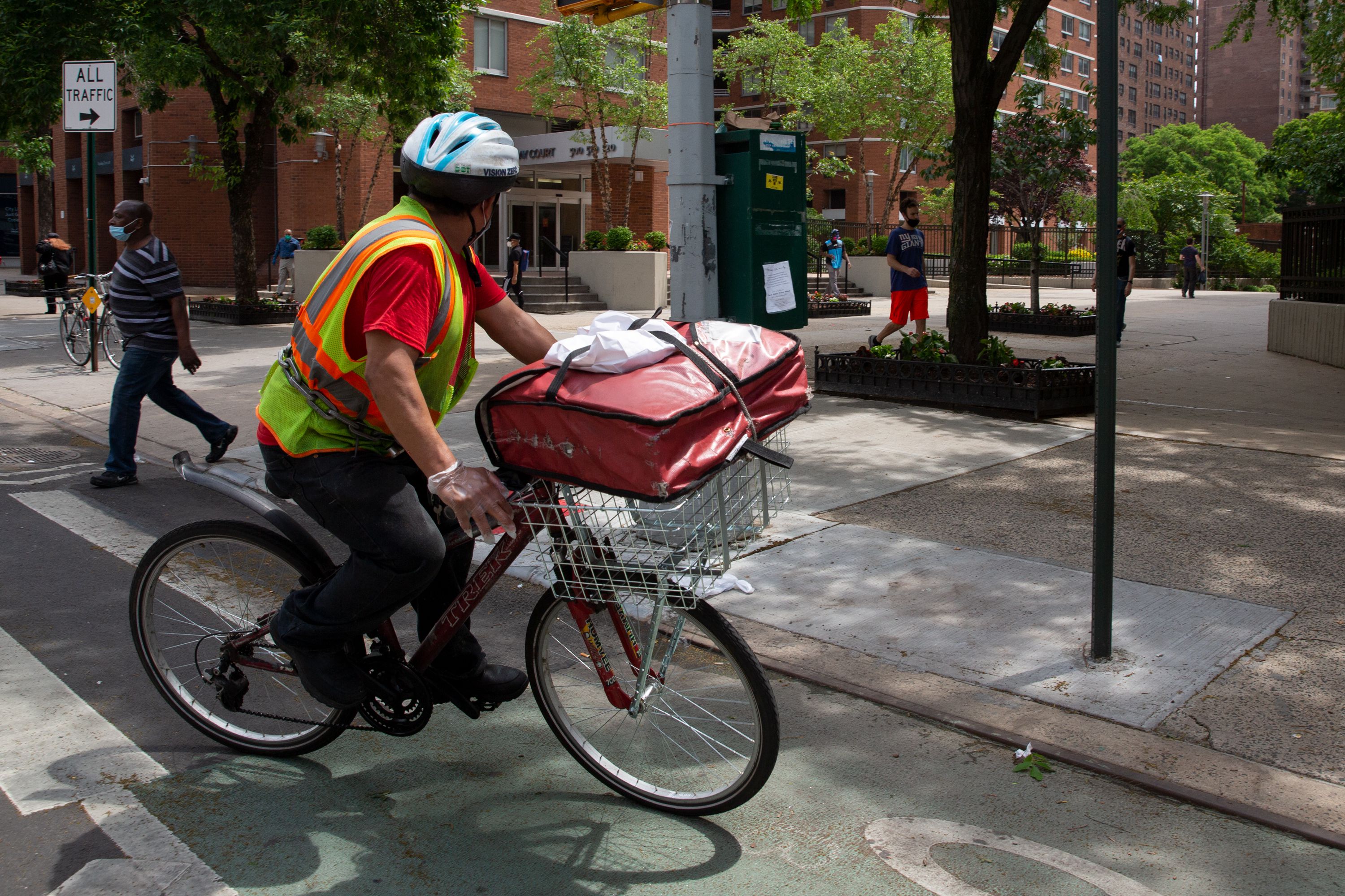 A delivery worker cycles through Kips Bay in Manhattan, June 4, 2020.