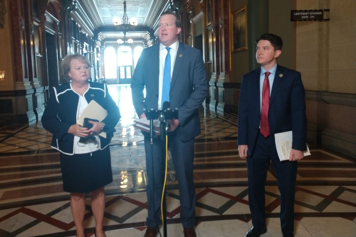 State Sen. Jason Plummer, R-Edwardsville, second from the right, speaks at a news conference in Springfield on Monday, as state Sen. Terri Bryant, R-Murphysboro, third from the right, and state Sen. Steve McClure, R-Springfield, right, listen.