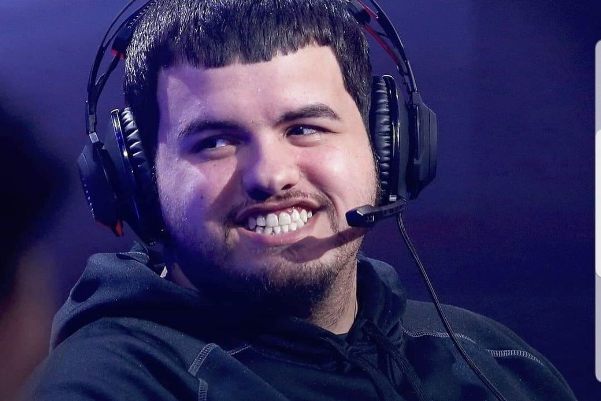 Timothy ‘oLARRY’ Anselimo, of Cavs Gaming, smiling during tournament play with a headset on
