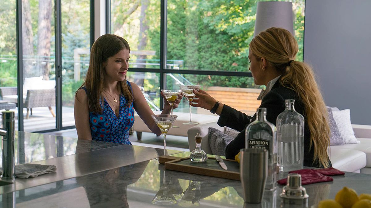 Stephanie (Anna Kendrick) and Emily (Blake Lively) share a cocktail in a screenshot from A Simple Favor