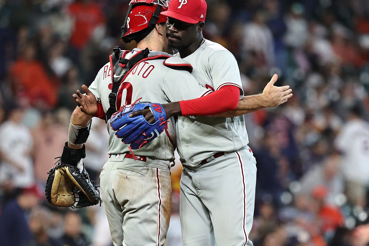 Yunior Marte of the Philadelphia Phillies hugs J.T. Realmuto after defeating the Houston Astros at Minute Maid Park on April 29, 2023 in Houston, Texas.