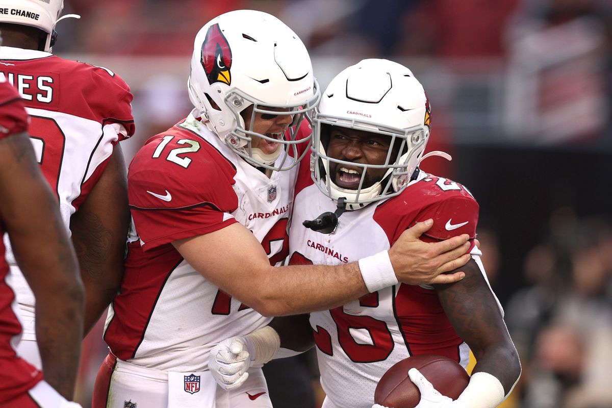 Eno Benjamin #26 of the Arizona Cardinals celebrates with Colt McCoy #12 after running the ball for a touchdown during the third quarter against the San Francisco 49ers at Levi’s Stadium on November 07, 2021 in Santa Clara, California.