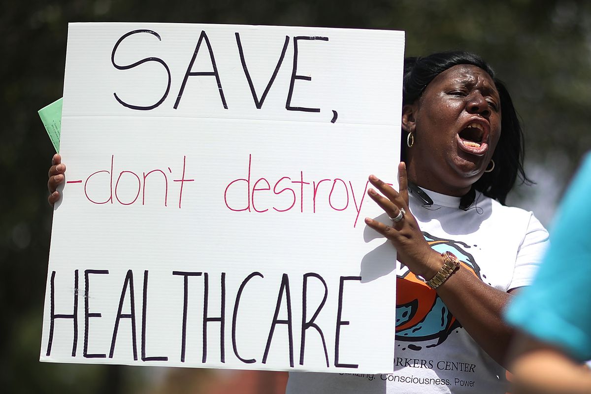 Activists Protest Healthcare Vote Of GOP Rep. Carlos Curbelo In Miami