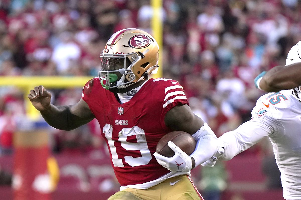 Deebo Samuel #19 of the San Francisco 49ers carries the ball against the Miami Dolphins during the fourth quarter of an NFL football game at Levi’s Stadium on December 04, 2022 in Santa Clara, California.